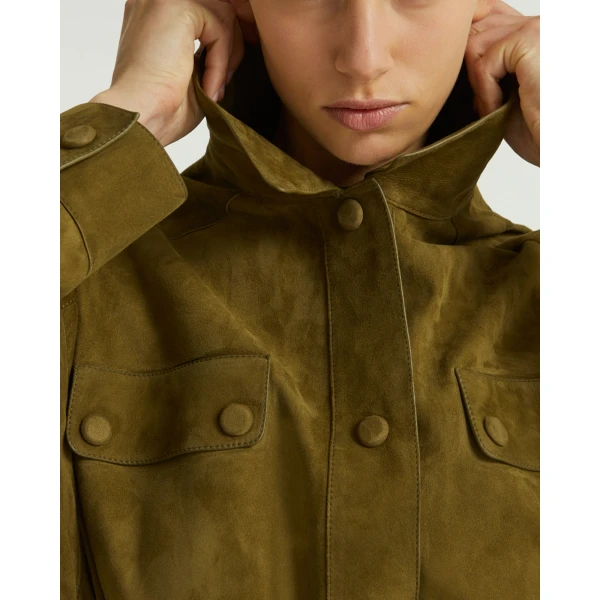 Woman wearing Yves Salomon shearling fur coat – luxury outerwear at Coveti