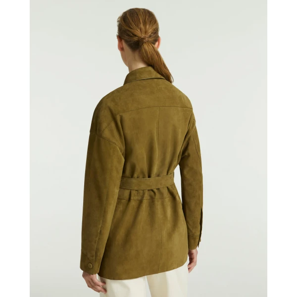 Woman wearing Yves Salomon shearling fur coat – luxury outerwear at Coveti