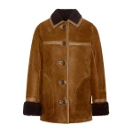 Woman wearing Yves Salomon shearling fur coat – luxury outerwear at Coveti