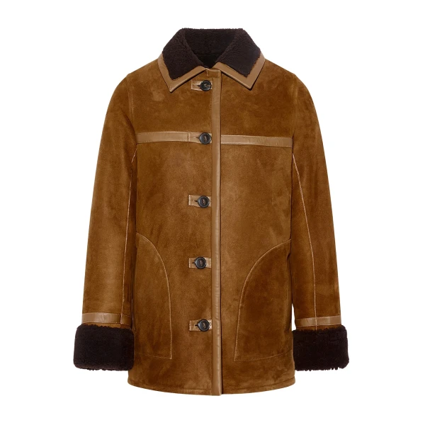 Woman wearing Yves Salomon shearling fur coat – luxury outerwear at Coveti