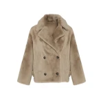 Woman wearing Yves Salomon shearling fur coat – luxury outerwear at Coveti