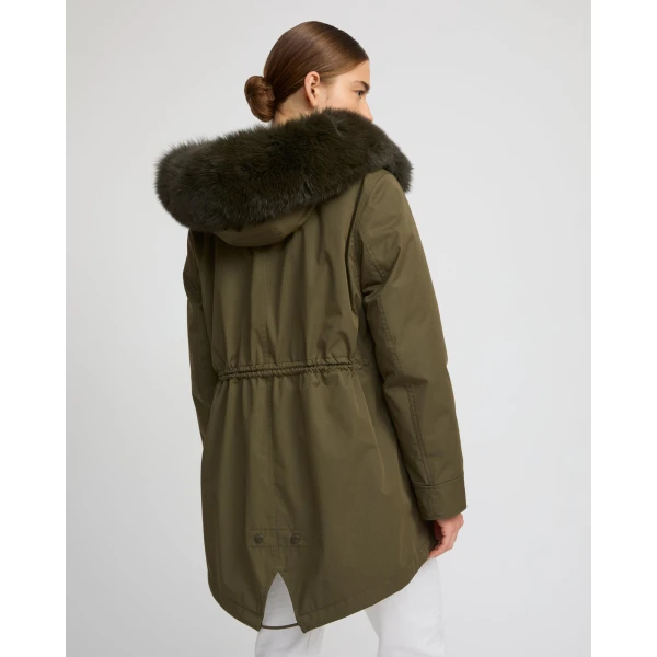 Woman wearing Yves Salomon shearling fur coat – luxury outerwear at Coveti