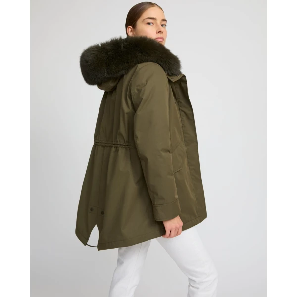 Woman wearing Yves Salomon shearling fur coat – luxury outerwear at Coveti
