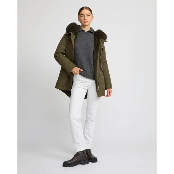 Woman wearing Yves Salomon shearling fur coat – luxury outerwear at Coveti