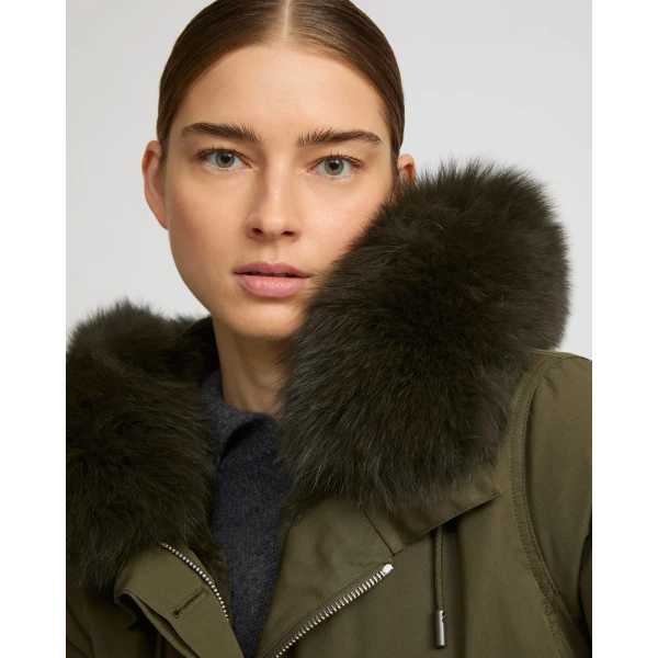 Woman wearing Yves Salomon shearling fur coat – luxury outerwear at Coveti