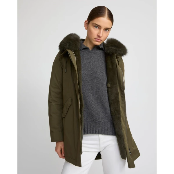Woman wearing Yves Salomon shearling fur coat – luxury outerwear at Coveti