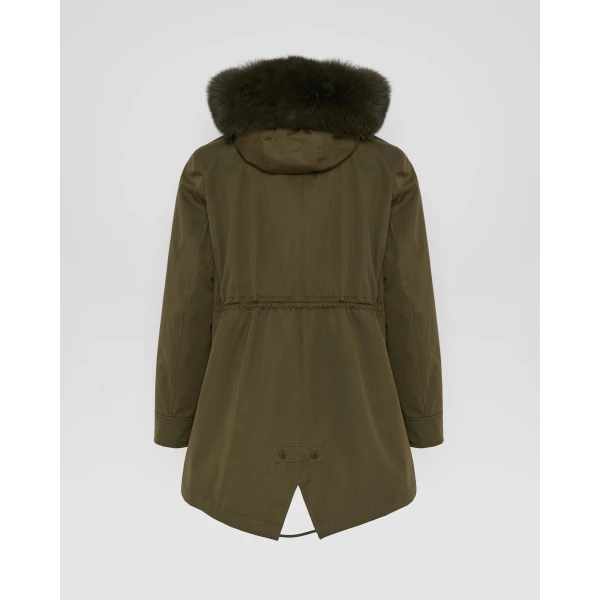 Woman wearing Yves Salomon shearling fur coat – luxury outerwear at Coveti
