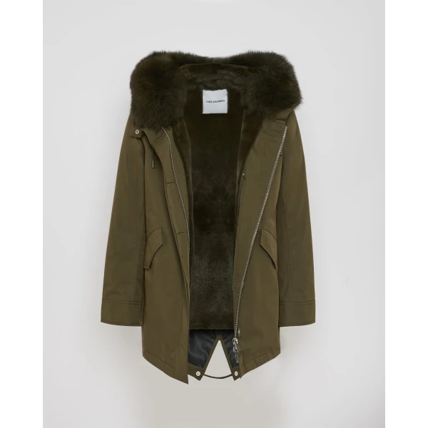 Woman wearing Yves Salomon shearling fur coat – luxury outerwear at Coveti