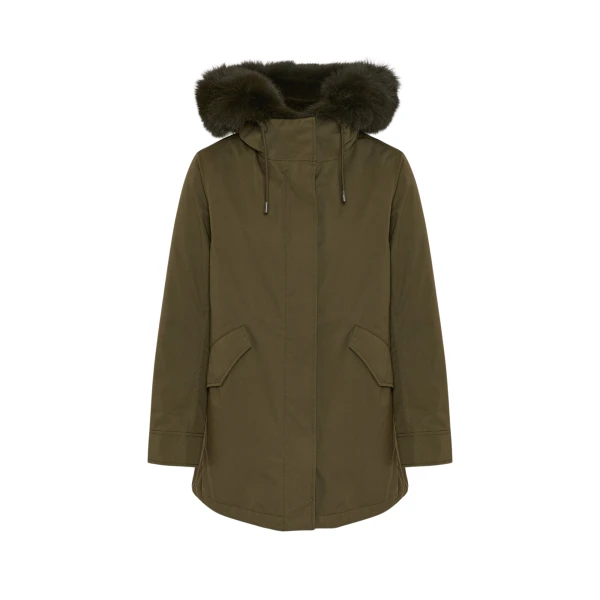 Woman wearing Yves Salomon shearling fur coat – luxury outerwear at Coveti