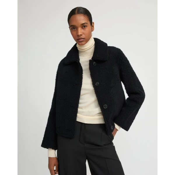 Woman wearing Yves Salomon shearling fur coat – luxury outerwear at Coveti