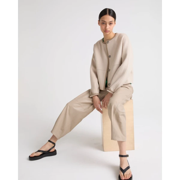 Woman wearing Yves Salomon shearling fur coat – luxury outerwear at Coveti