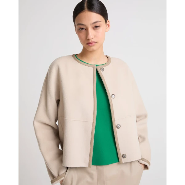 Woman wearing Yves Salomon shearling fur coat – luxury outerwear at Coveti