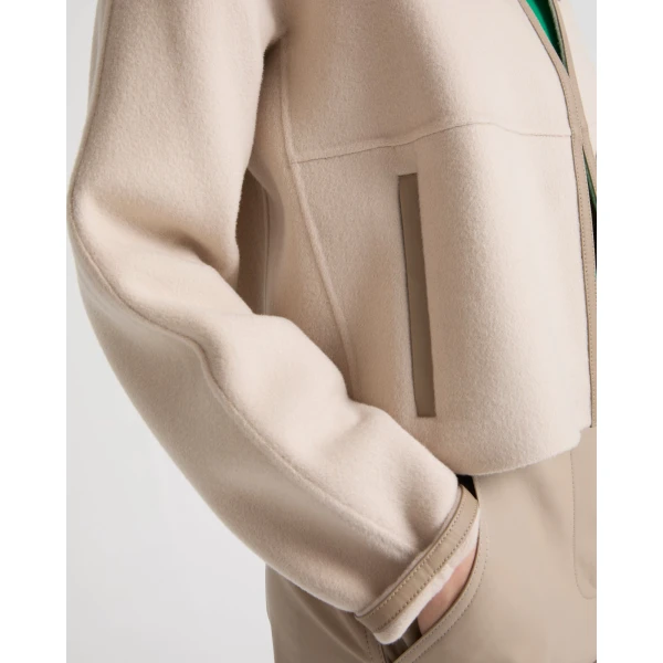 Woman wearing Yves Salomon shearling fur coat – luxury outerwear at Coveti