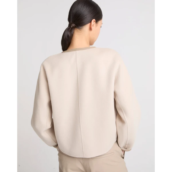 Woman wearing Yves Salomon shearling fur coat – luxury outerwear at Coveti
