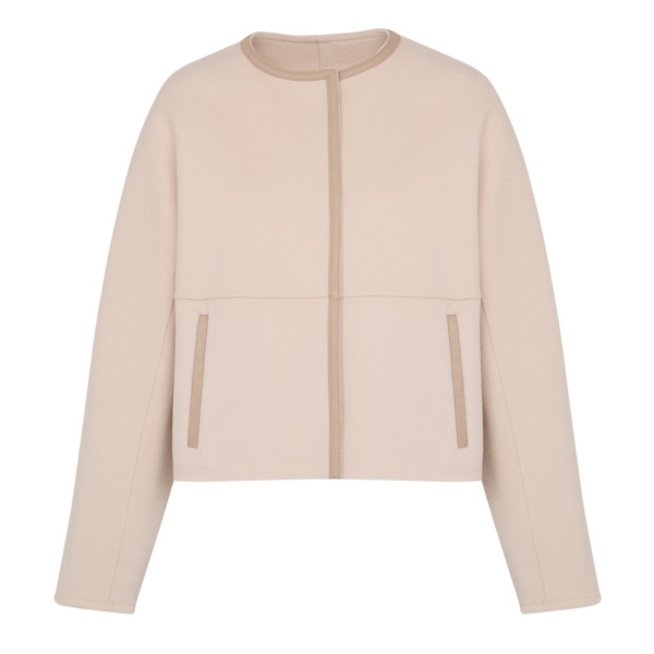 Woman wearing Yves Salomon shearling fur coat – luxury outerwear at Coveti