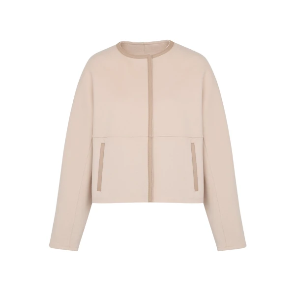 Woman wearing Yves Salomon shearling fur coat – luxury outerwear at Coveti