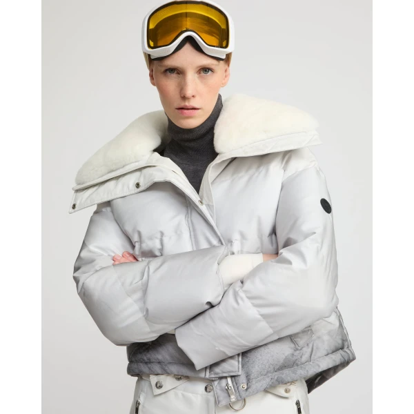 Woman wearing Yves Salomon shearling fur coat – luxury outerwear at Coveti