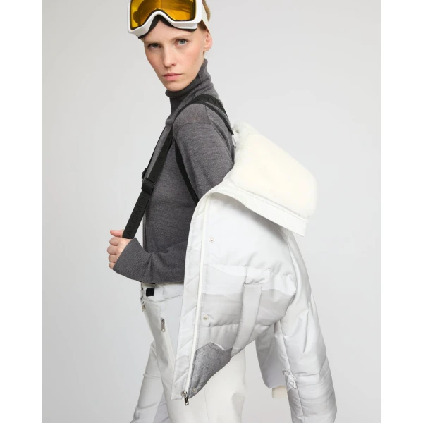 Woman wearing Yves Salomon shearling fur coat – luxury outerwear at Coveti