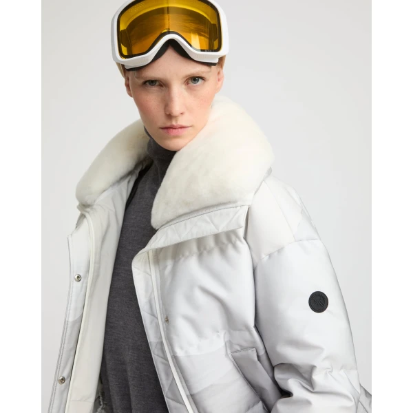 Woman wearing Yves Salomon shearling fur coat – luxury outerwear at Coveti