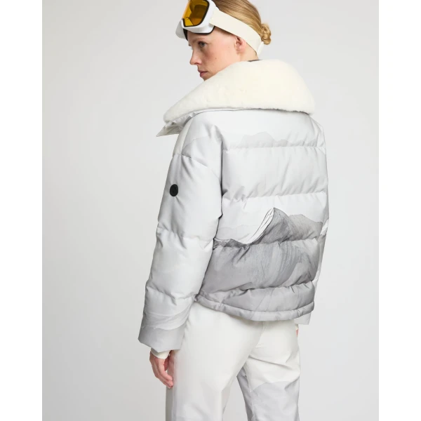 Woman wearing Yves Salomon shearling fur coat – luxury outerwear at Coveti