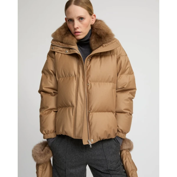 Woman wearing Yves Salomon shearling fur coat – luxury outerwear at Coveti