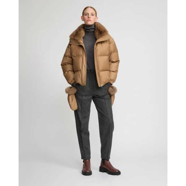 Woman wearing Yves Salomon shearling fur coat – luxury outerwear at Coveti