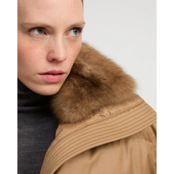 Woman wearing Yves Salomon shearling fur coat – luxury outerwear at Coveti