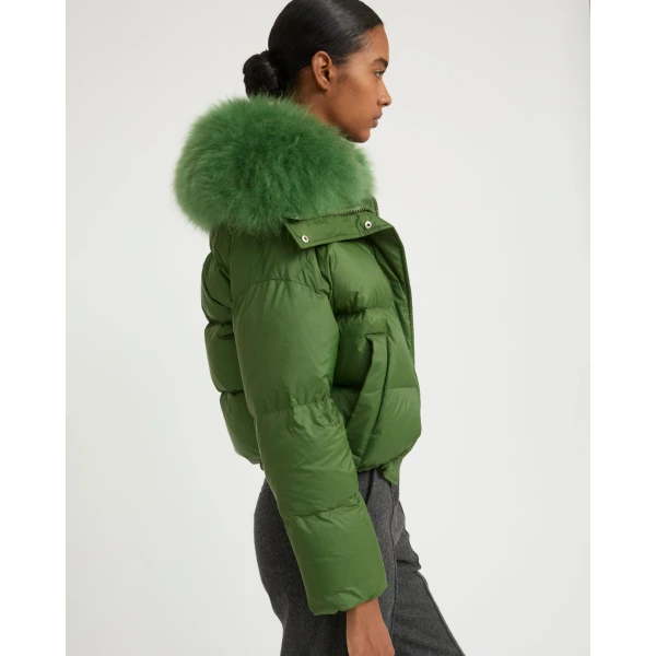 Woman wearing Yves Salomon shearling fur coat – luxury outerwear at Coveti