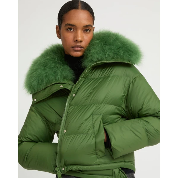 Woman wearing Yves Salomon shearling fur coat – luxury outerwear at Coveti