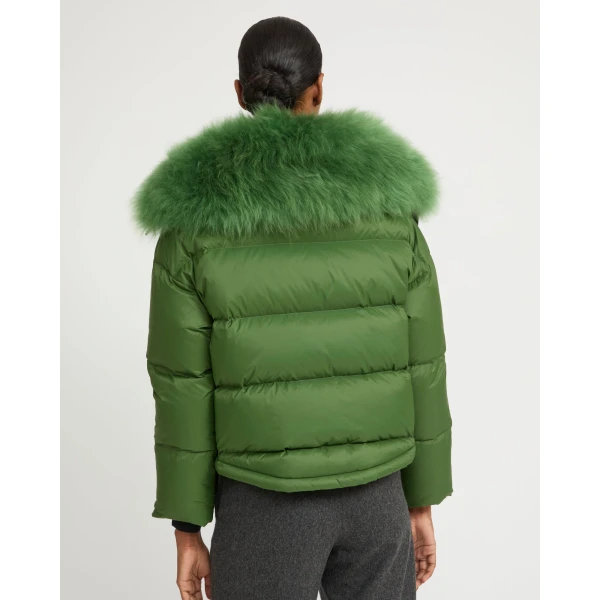 Woman wearing Yves Salomon shearling fur coat – luxury outerwear at Coveti