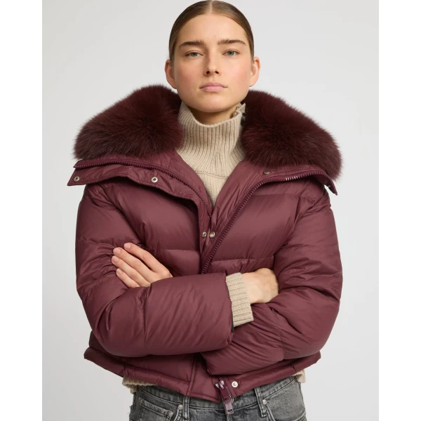 Woman wearing Yves Salomon shearling fur coat – luxury outerwear at Coveti