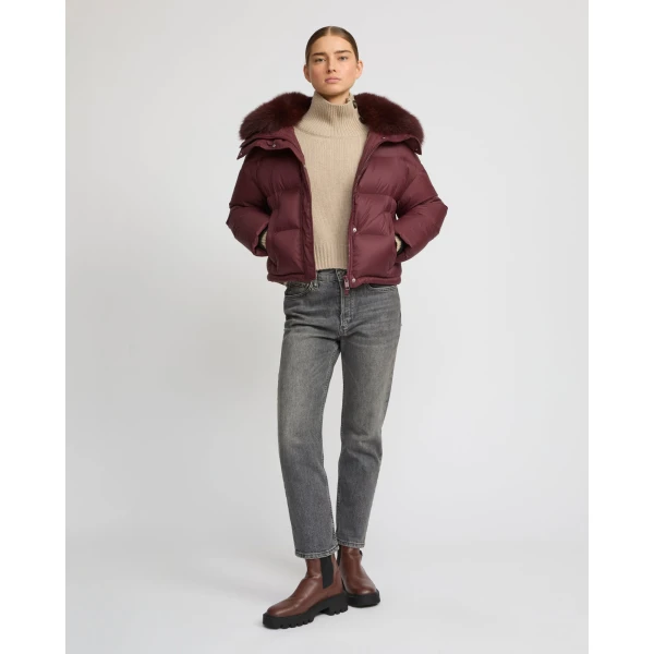 Woman wearing Yves Salomon shearling fur coat – luxury outerwear at Coveti