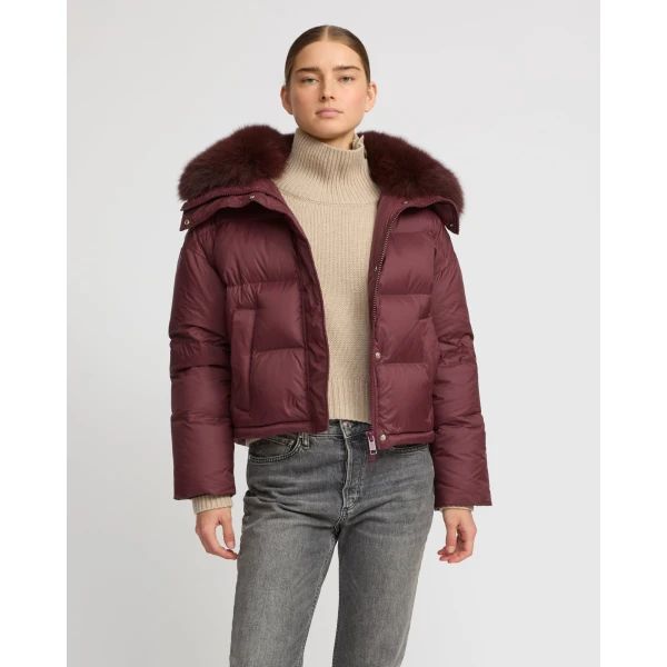 Woman wearing Yves Salomon shearling fur coat – luxury outerwear at Coveti