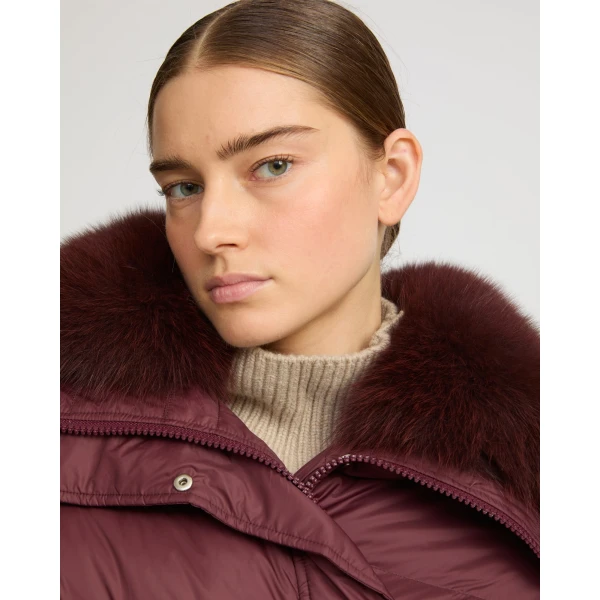 Woman wearing Yves Salomon shearling fur coat – luxury outerwear at Coveti