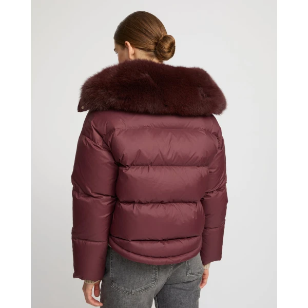 Woman wearing Yves Salomon shearling fur coat – luxury outerwear at Coveti