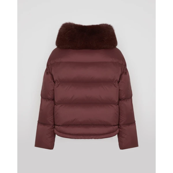 Woman wearing Yves Salomon shearling fur coat – luxury outerwear at Coveti