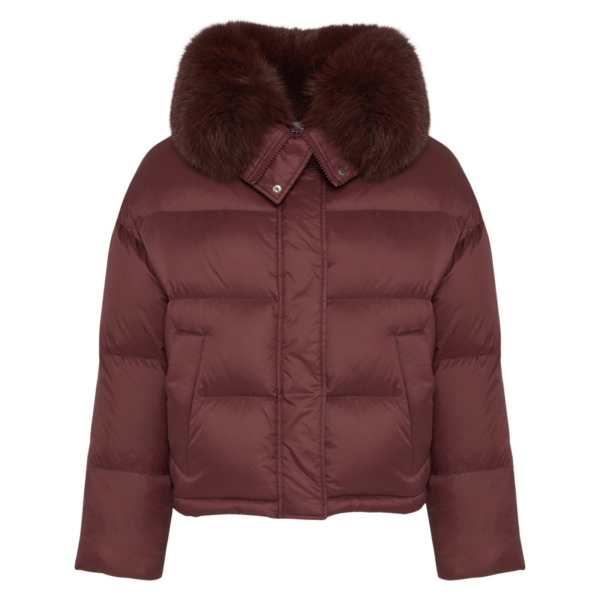Woman wearing Yves Salomon shearling fur coat – luxury outerwear at Coveti