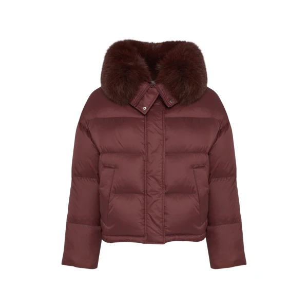 Woman wearing Yves Salomon shearling fur coat – luxury outerwear at Coveti