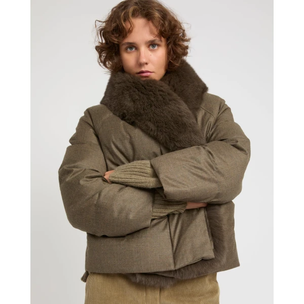 Woman wearing Yves Salomon shearling fur coat – luxury outerwear at Coveti