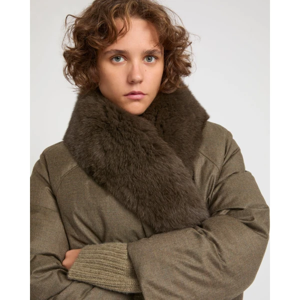 Woman wearing Yves Salomon shearling fur coat – luxury outerwear at Coveti