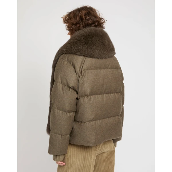 Woman wearing Yves Salomon shearling fur coat – luxury outerwear at Coveti