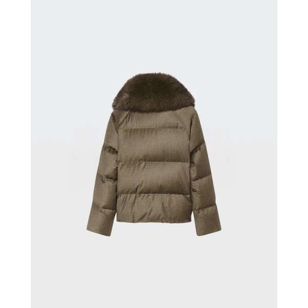 Woman wearing Yves Salomon shearling fur coat – luxury outerwear at Coveti