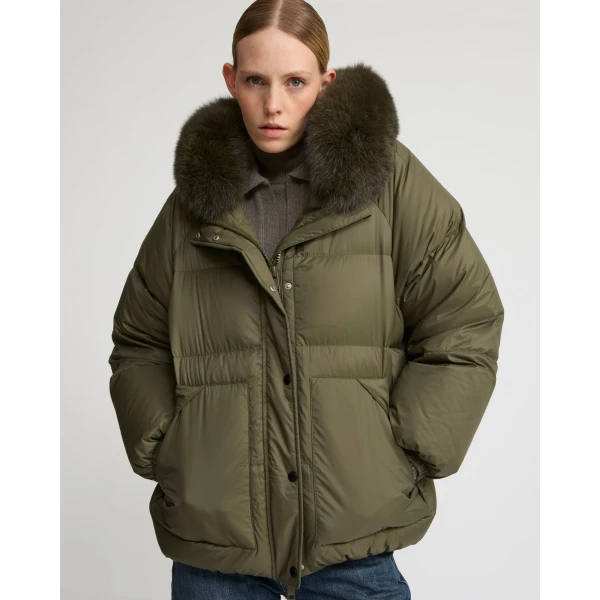 Woman wearing Yves Salomon shearling fur coat – luxury outerwear at Coveti