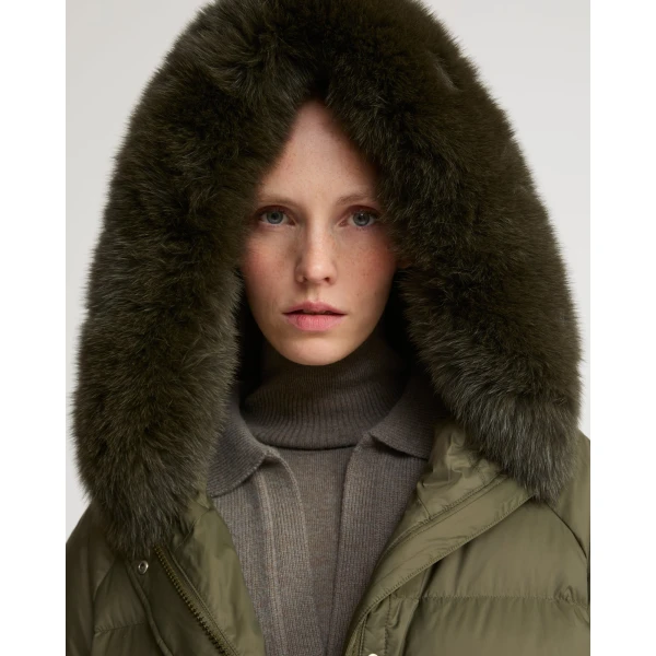 Woman wearing Yves Salomon shearling fur coat – luxury outerwear at Coveti