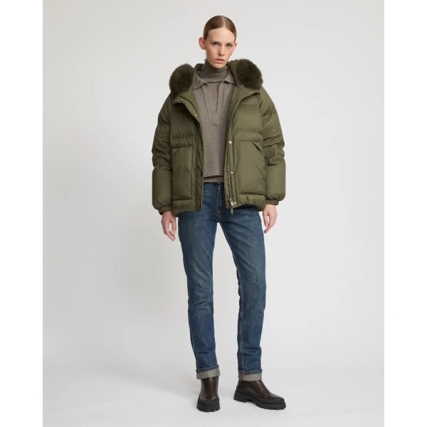 Woman wearing Yves Salomon shearling fur coat – luxury outerwear at Coveti