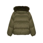 Woman wearing Yves Salomon shearling fur coat – luxury outerwear at Coveti