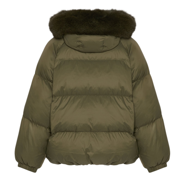 Woman wearing Yves Salomon shearling fur coat – luxury outerwear at Coveti