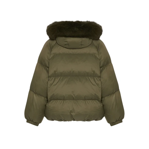 Woman wearing Yves Salomon shearling fur coat – luxury outerwear at Coveti
