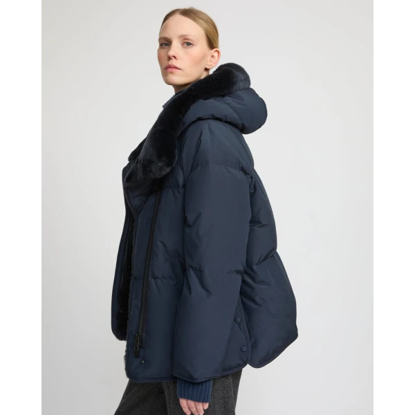 Woman wearing Yves Salomon shearling fur coat – luxury outerwear at Coveti
