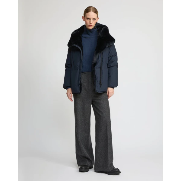 Woman wearing Yves Salomon shearling fur coat – luxury outerwear at Coveti